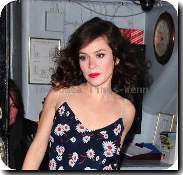 Anna Friel in a flowery dress, leaves the Theatre Royal after her latest stage performance in 'Breakfast At Tiffany's' London.