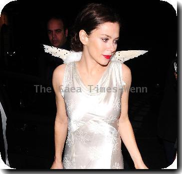 Anna Friel wearing a long white dress, angel wings and a feather mask, leaves the Theatre Royal after her latest stage performance in 'Breakfast At Tiffany's'London.