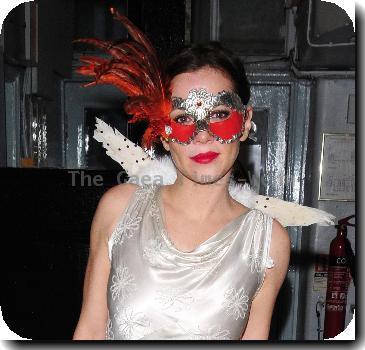 Anna Friel wearing a long white dress, angel wings and a feather mask, leaves the Theatre Royal after her latest stage performance in 'Breakfast At Tiffany's'London.