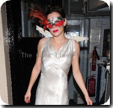Anna Friel wearing a long white dress, angel wings and a feather mask, leaves the Theatre Royal after her latest stage performance in 'Breakfast At Tiffany's'London.