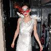 Anna Friel wearing a long white dress, angel wings and a feather mask, leaves the Theatre Royal after her latest stage performance in 'Breakfast At Tiffany's'London.