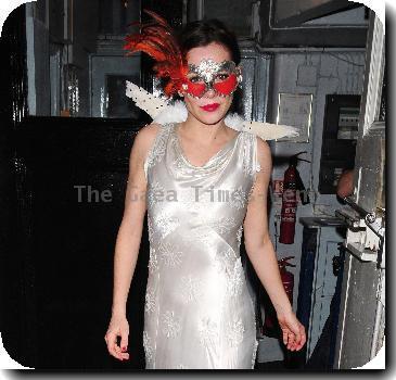 Anna Friel wearing a long white dress, angel wings and a feather mask, leaves the Theatre Royal after her latest stage performance in 'Breakfast At Tiffany's'London.