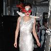 Anna Friel wearing a long white dress, angel wings and a feather mask, leaves the Theatre Royal after her latest stage performance in 'Breakfast At Tiffany's'London.