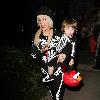 Singer Christina Aguilera and son Max arriving at a Halloween party dressed in matching skeleton costumes.Los Angeles, California.