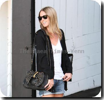 Nicky Hilton wearing black ankle boots and denim shorts, leaves the Chateau Marmont hotel in West Hollywood.