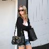 Nicky Hilton wearing black ankle boots and denim shorts, leaves the Chateau Marmont hotel in West Hollywood.