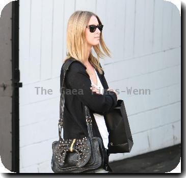 Nicky Hilton wearing black ankle boots and denim shorts, leaves the Chateau Marmont hotel in West Hollywood.