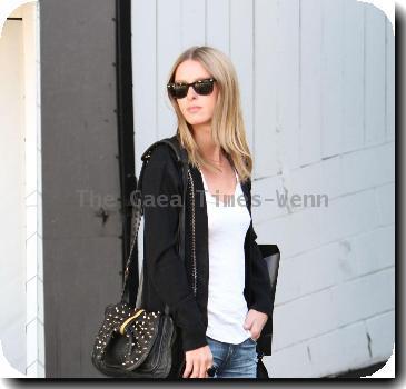 Nicky Hilton wearing black ankle boots and denim shorts, leaves the Chateau Marmont hotel in West Hollywood.