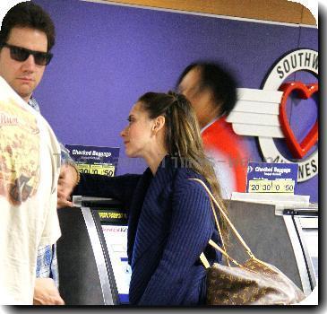 Jennifer Love Hewitt and boyfriend Jamie Kennedy catch a flight out of Burbank Airport.