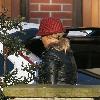 ***Exclusive***Kerry Katona sporting a fake tan as she leaves her house wearing a tartan hat and leather biker jacket. It looks as if she has just returned from another holiday in the sun, however, on closer inspection, her neck, hands and legs are a a few shades lighter. So it looks like a fake bake. Liverpool.