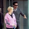 Deborra-Lee Furness and Hugh Jackman Hugh Jackman greets a doorman while leaving his Manhattan residence with his wife New York City.