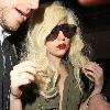 Lady Gaga is surrounded by paparazzi as she arrives at LAX airport after flying in from London Los Angeles.