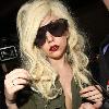 Lady Gaga is surrounded by paparazzi as she arrives at LAX airport after flying in from London Los Angeles.