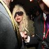 Lady Gaga is surrounded by paparazzi as she arrives at LAX airport after flying in from London Los Angeles.