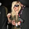 Lady Gaga is surrounded by paparazzi as she arrives at LAX airport after flying in from London Los Angeles.