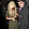 Lady Gaga is surrounded by paparazzi as she arrives at LAX airport after flying in from London Los Angeles.