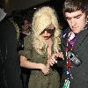 Lady Gaga is surrounded by paparazzi as she arrives at LAX airport after flying in from London Los Angeles.