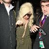 Lady Gaga is surrounded by paparazzi as she arrives at LAX airport after flying in from London Los Angeles.