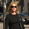 **Exclusive**Melanie Griffith enjoys a cigarette while out shopping in Beverly Hills Los Angeles.