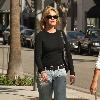 **Exclusive**Melanie Griffith enjoys a cigarette while out shopping in Beverly Hills Los Angeles.