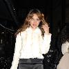 Kelly Brook wearing a white fur coat outside the Noel Coward Theatre, where she stars in the West End production of 'Calendar Girls' London.