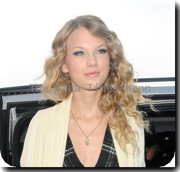 American Country singer Taylor Swift leaves her hotel wearing a black dress and cream cardigan.