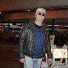 Chevy Chase arrives at LAX airport on an American Airlines flight from New York City.Los Angeles, California.