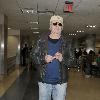 Chevy Chase arrives at LAX airport on an American Airlines flight from New York City.Los Angeles, California.