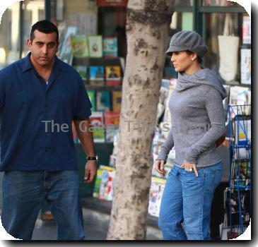 Jennifer Lopezwalks to her new black Audi SUV, after leaving Duck Soup bookstore, wearing a grey jumper and matching scarf and cap.Los Angeles, California.