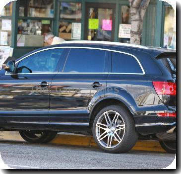 Jennifer Lopezwalks to her new black Audi SUV, after leaving Duck Soup bookstore, wearing a grey jumper and matching scarf and cap.Los Angeles, California.