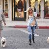 Ashley Tisdale and his father, Mike Tisdale, walk their dog in Toluca Lake.