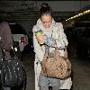 Jessica Alba 
looking through her Escada handbag while leaving Whole Foods Market in Beverly Hills after shopping for groceries.