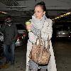 Jessica Alba 
looking through her Escada handbag while leaving Whole Foods Market in Beverly Hills after shopping for groceries.