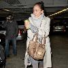 Jessica Alba 
looking through her Escada handbag while leaving Whole Foods Market in Beverly Hills after shopping for groceries.