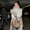 Jessica Alba 
looking through her Escada handbag while leaving Whole Foods Market in Beverly Hills after shopping for groceries.