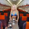 Glamour model Laura Lacole
previews the new easyJet Airbus A319 at Belfast?s International Airport.  Laura was specially invited by easyJet marketing manager Trevor Spinks and the captain into the cockpit of the plane to get an insight into flying the new planes.  The new easyJet Airbus A319 gives customers and staff much more room when travelling as glamorous Laura shows as she poses as a member of the cabin crew on the aircraft.  Laura said: \