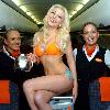 Glamour model Laura Lacole
previews the new easyJet Airbus A319 at Belfast?s International Airport.  Laura was specially invited by easyJet marketing manager Trevor Spinks and the captain into the cockpit of the plane to get an insight into flying the new planes.  The new easyJet Airbus A319 gives customers and staff much more room when travelling as glamorous Laura shows as she poses as a member of the cabin crew on the aircraft.  Laura said: \