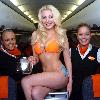 Glamour model Laura Lacole
previews the new easyJet Airbus A319 at Belfast?s International Airport.  Laura was specially invited by easyJet marketing manager Trevor Spinks and the captain into the cockpit of the plane to get an insight into flying the new planes.  The new easyJet Airbus A319 gives customers and staff much more room when travelling as glamorous Laura shows as she poses as a member of the cabin crew on the aircraft.  Laura said: \