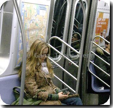 Alicia Silverstone
listening to her iPod while riding the subway in Manhattan.