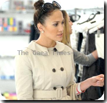 Jennifer Lopez shops at the Alice + Olivia store on Robertson Boulevard. The singer wore a cropped coat and held a matching beige handbag.
