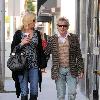 Penny Lancaster and Rod Stewart 
holding hands while out and about in Beverly Hills.