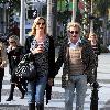 Penny Lancaster and Rod Stewart 
holding hands while out and about in Beverly Hills.