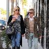 Penny Lancaster and Rod Stewart 
holding hands while out and about in Beverly Hills.