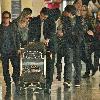 Michael J Fox arrives at LAX airport with his family and get in their waiting van.