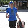 Robert Downey Jr. 
goes shopping at Cross Creek in Malibu, carrying a coffee..