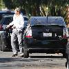 Bradley Cooper arrives back home in his Toyota Prius car, wearing a military cap and sleeper type shoes and blue tint sunglassesLos Angeles.