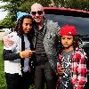 Rapper, PitBull real name Armando Christian P'rez (centre) at the City Miami Parks and Recreation and Community Organizations Annual Toy Give-A-Way at Charles Hadley Park.