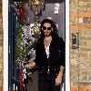 Russell Brand 
leaving his home on Christmas Eve..