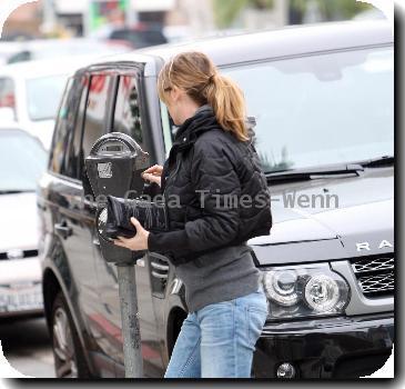 Ellen Pompeo returns to her car after buyintog tickets for the new movie Avatar.Los Angeles.