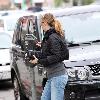 Ellen Pompeo returns to her car after buyintog tickets for the new movie Avatar.Los Angeles.